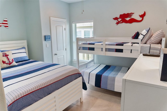 bedroom featuring light tile patterned floors