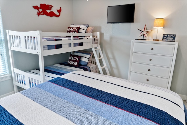 bedroom featuring baseboards