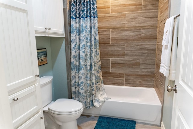 bathroom featuring tile patterned floors, toilet, and shower / tub combo