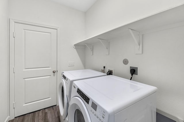 clothes washing area featuring independent washer and dryer and dark hardwood / wood-style floors