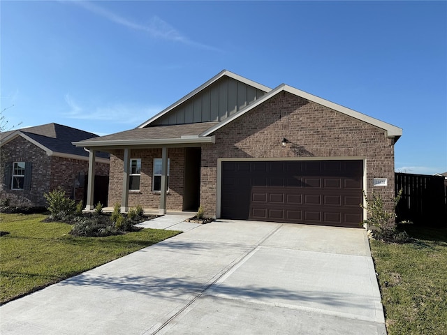 ranch-style house with brick siding, board and batten siding, a front yard, a garage, and driveway