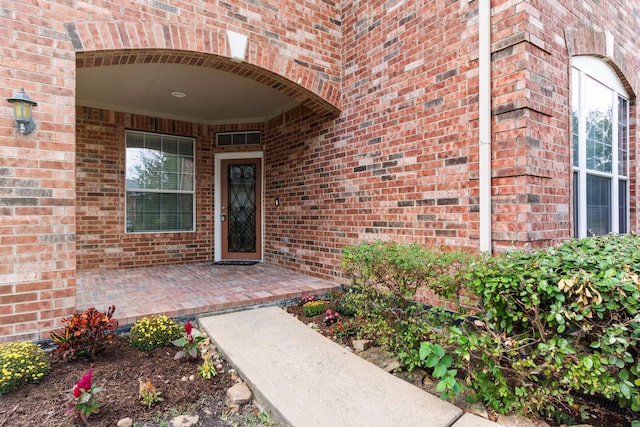 entrance to property featuring a patio area