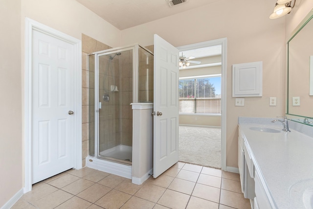 bathroom with vanity, tile patterned flooring, and a shower with door