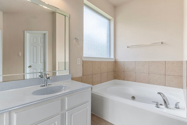 bathroom featuring vanity, tile patterned floors, and a bathtub