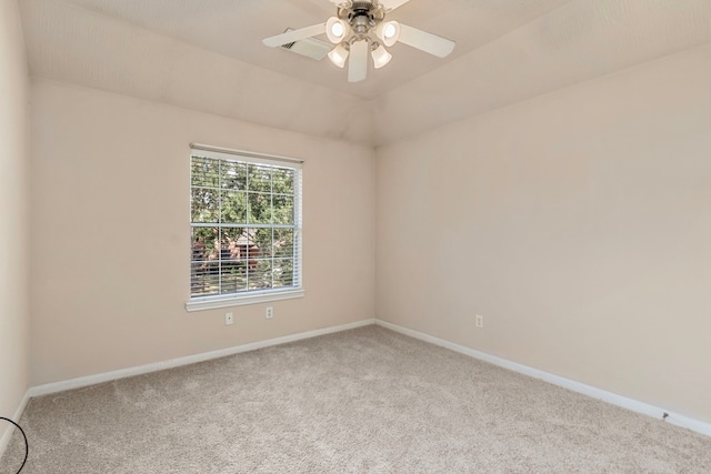 spare room with light carpet and ceiling fan