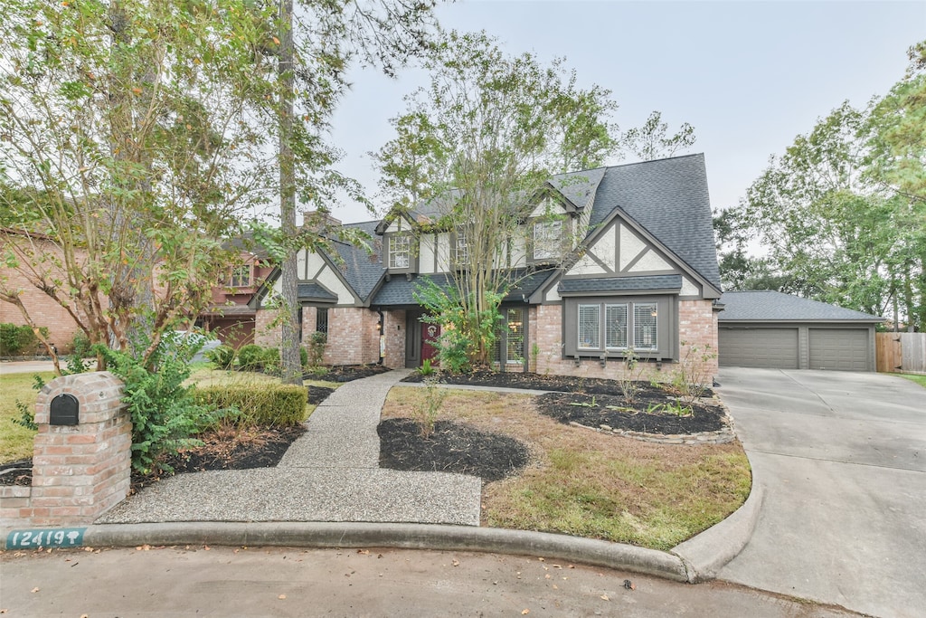 tudor-style house featuring a garage