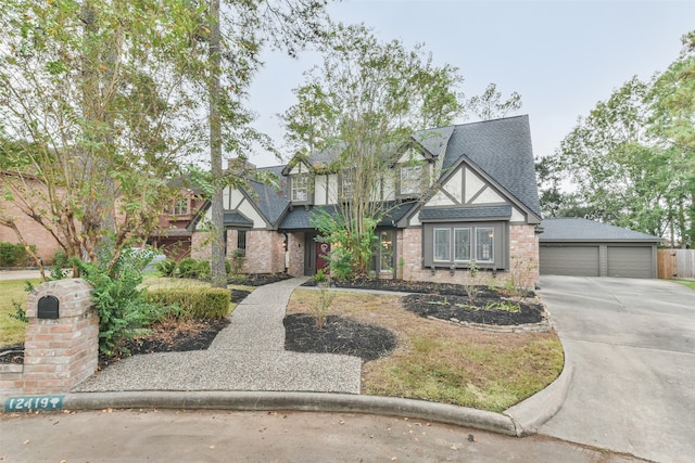 tudor-style house featuring a garage