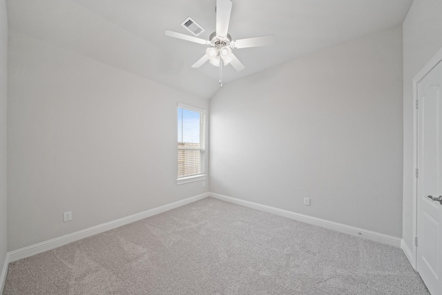 carpeted empty room with lofted ceiling and ceiling fan