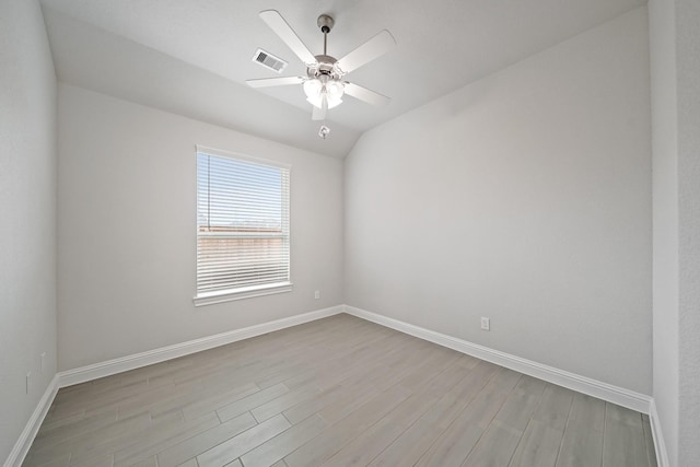 unfurnished room with ceiling fan, lofted ceiling, and light hardwood / wood-style floors