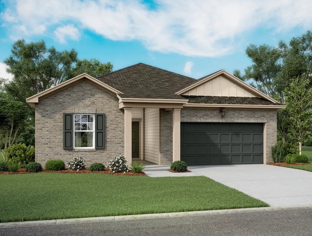 view of front facade with a front yard and a garage