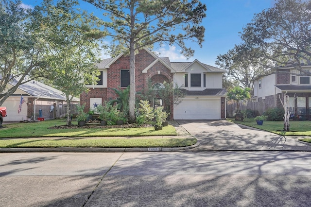 view of front of property with a front yard and a garage