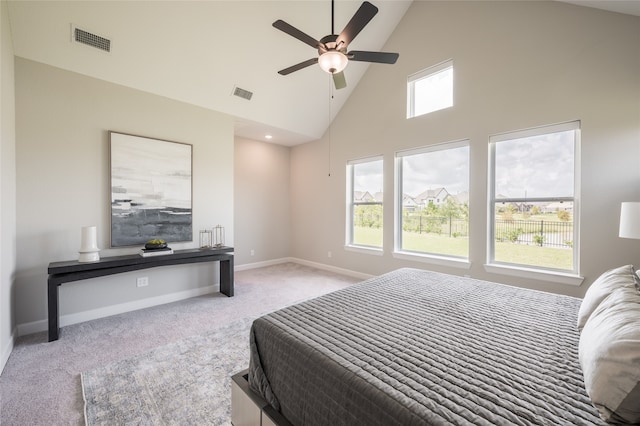 bedroom with light carpet, high vaulted ceiling, and ceiling fan