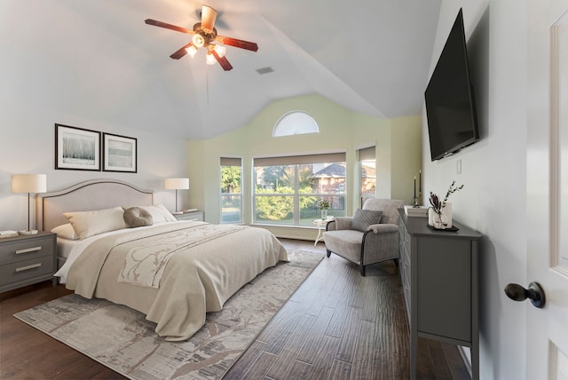 bedroom featuring ceiling fan, lofted ceiling, and dark hardwood / wood-style flooring