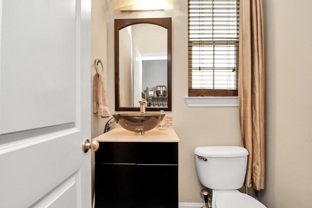 bathroom with vanity and toilet