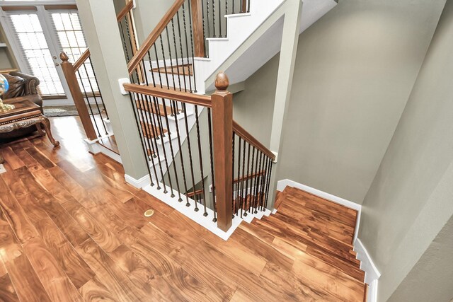 staircase featuring hardwood / wood-style floors