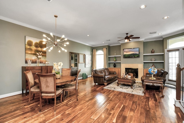 dining space featuring crown molding, a wealth of natural light, and wood-type flooring