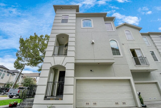 multi unit property featuring a garage