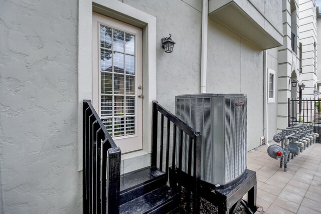 doorway to property featuring central AC