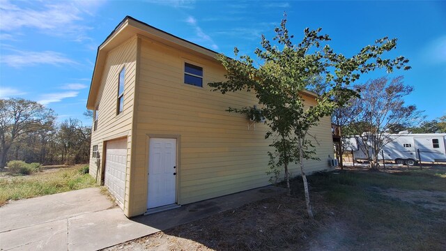 view of property exterior with a garage