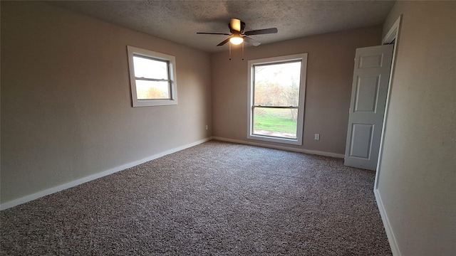 1284 Beaver Lake Dr, Caldwell, TX 77836 - carpeted empty room featuring a textured ceiling, ceiling fan, and baseboards
