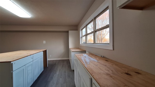 1284 Beaver Lake Dr, Caldwell, TX 77836 - kitchen featuring dark wood-style floors, butcher block countertops, and baseboards