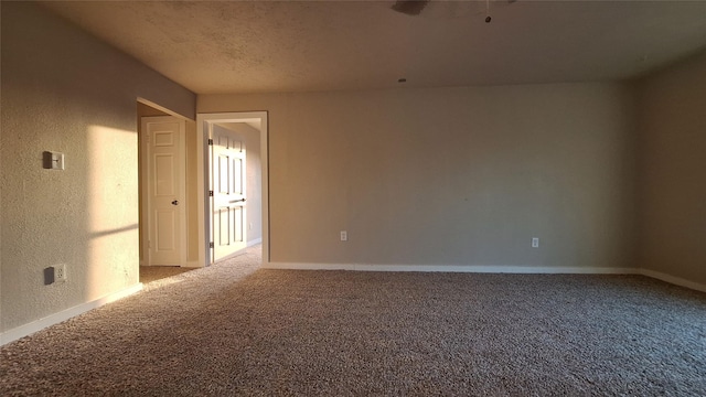 1284 Beaver Lake Dr, Caldwell, TX 77836 - carpeted spare room featuring a textured wall and baseboards