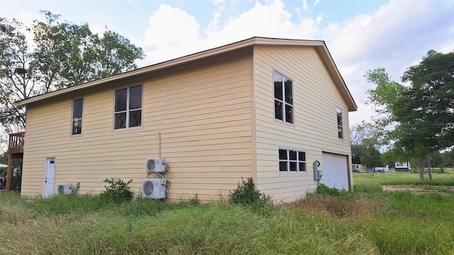 1284 Beaver Lake Dr, Caldwell, TX 77836 - view of home's exterior with ac unit and a garage