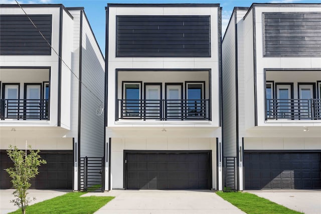 view of front of home featuring a balcony and a garage