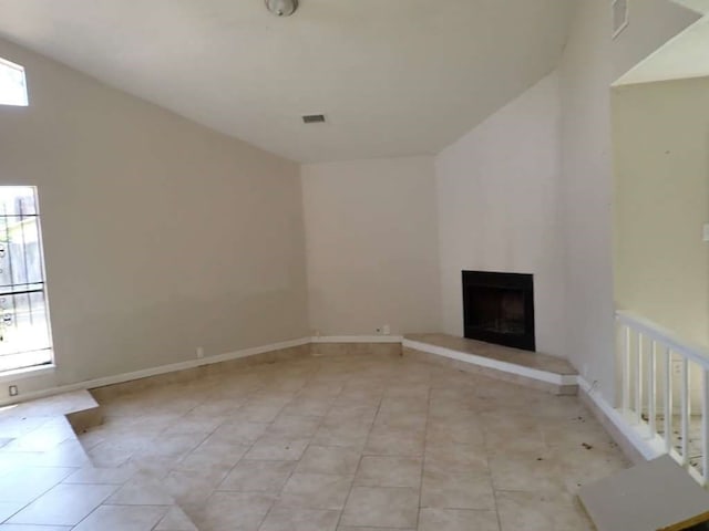 unfurnished living room with light tile patterned flooring