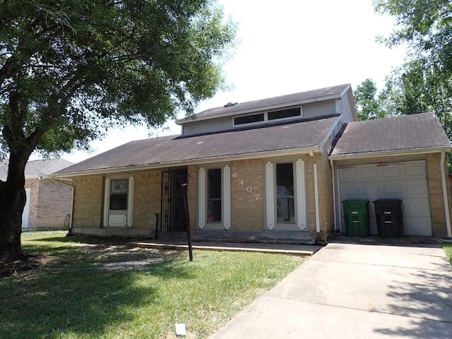 front of property featuring a front yard and a garage