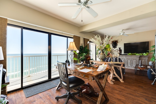 dining area featuring a water view, ceiling fan, and hardwood / wood-style floors