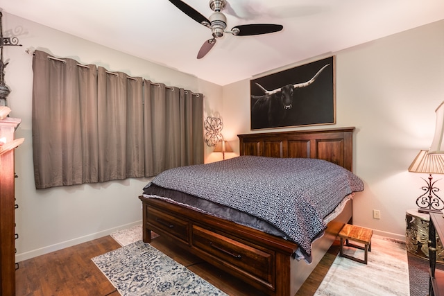 bedroom featuring hardwood / wood-style floors and ceiling fan