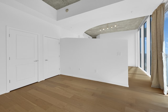 unfurnished room featuring wood-type flooring