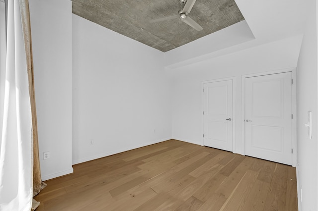 spare room featuring ceiling fan and light wood-type flooring