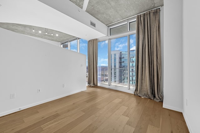 spare room featuring light hardwood / wood-style flooring