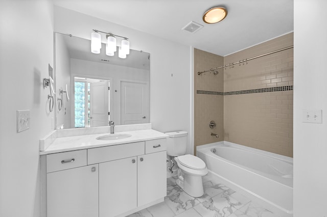 full bathroom with vanity, toilet, and tiled shower / bath