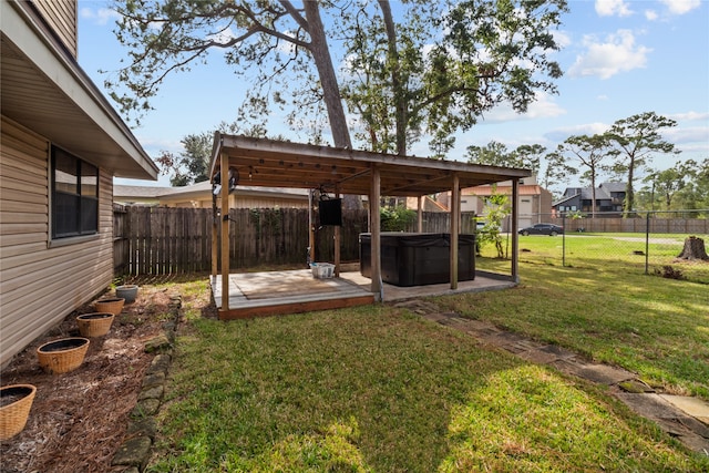 view of yard with a hot tub