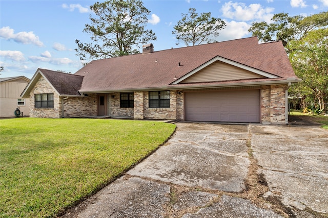 view of front of home with a garage and a front yard