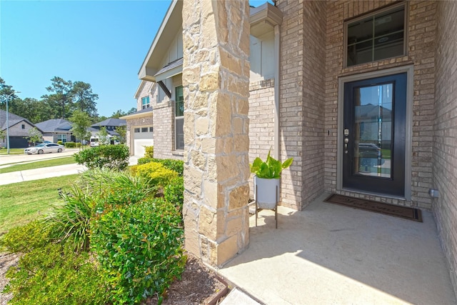 view of exterior entry featuring a garage