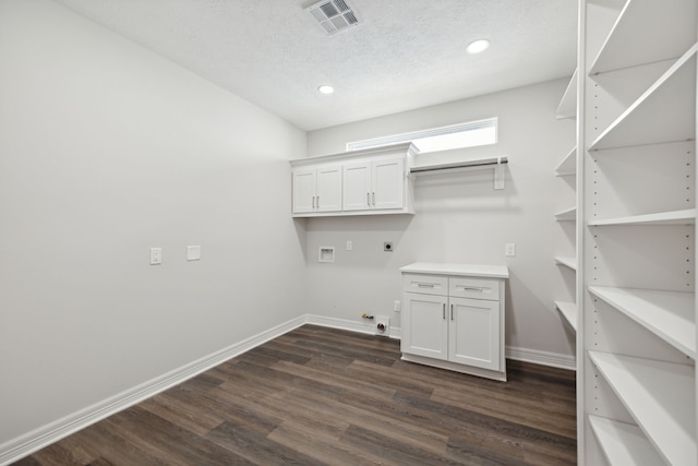 laundry area featuring hookup for an electric dryer, a textured ceiling, hookup for a gas dryer, washer hookup, and dark hardwood / wood-style floors