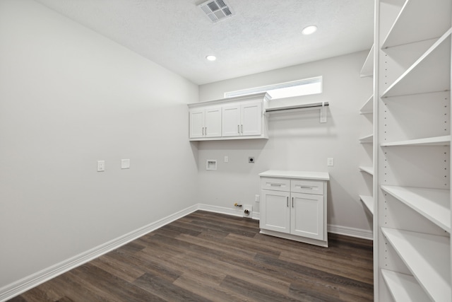 laundry area with laundry area, gas dryer hookup, hookup for an electric dryer, visible vents, and dark wood-style floors