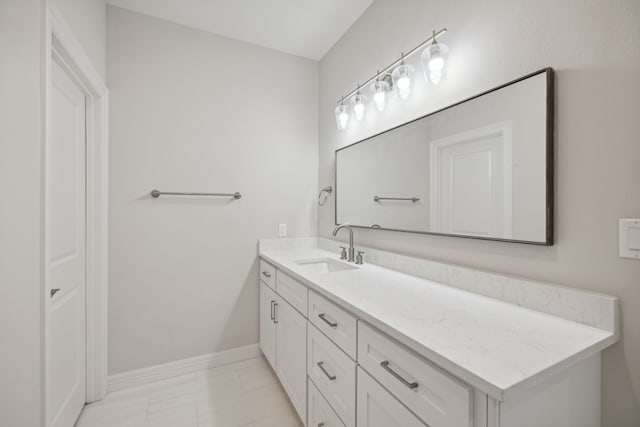 bathroom featuring vanity and baseboards