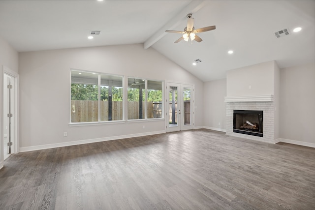 unfurnished living room featuring wood-type flooring, a fireplace, ceiling fan, beamed ceiling, and high vaulted ceiling