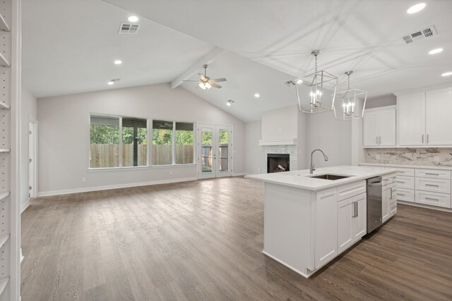 kitchen featuring white cabinets, sink, a center island with sink, and dark hardwood / wood-style flooring