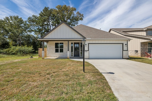 view of front of property featuring board and batten siding, roof with shingles, an attached garage, and stone siding