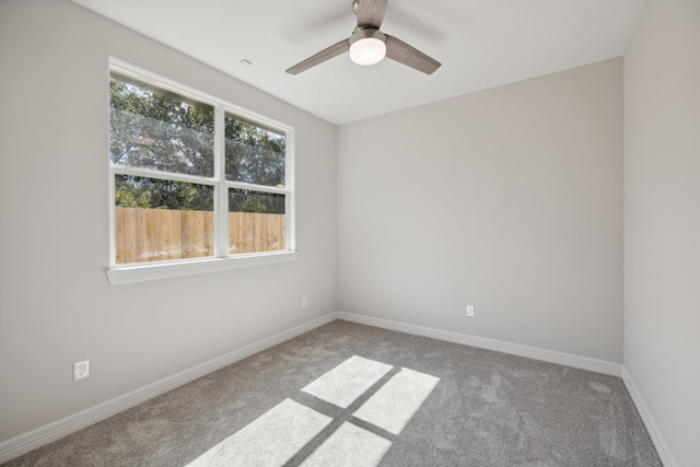 empty room with light carpet and ceiling fan