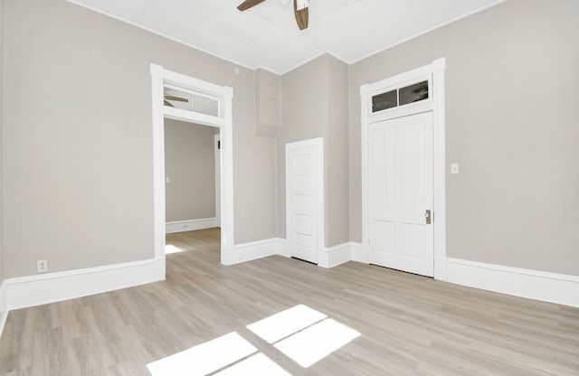 empty room with light hardwood / wood-style floors and ceiling fan