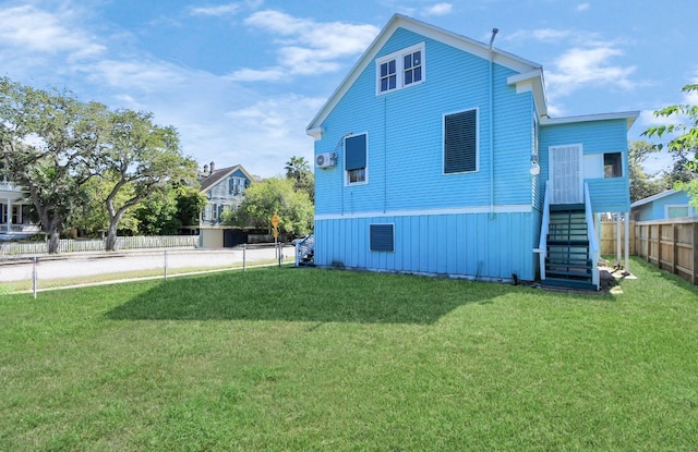 view of home's exterior with a lawn