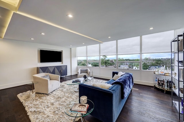 living area featuring baseboards, recessed lighting, and dark wood-style flooring