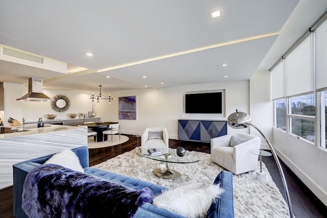living area featuring dark wood-style floors, visible vents, recessed lighting, and baseboards